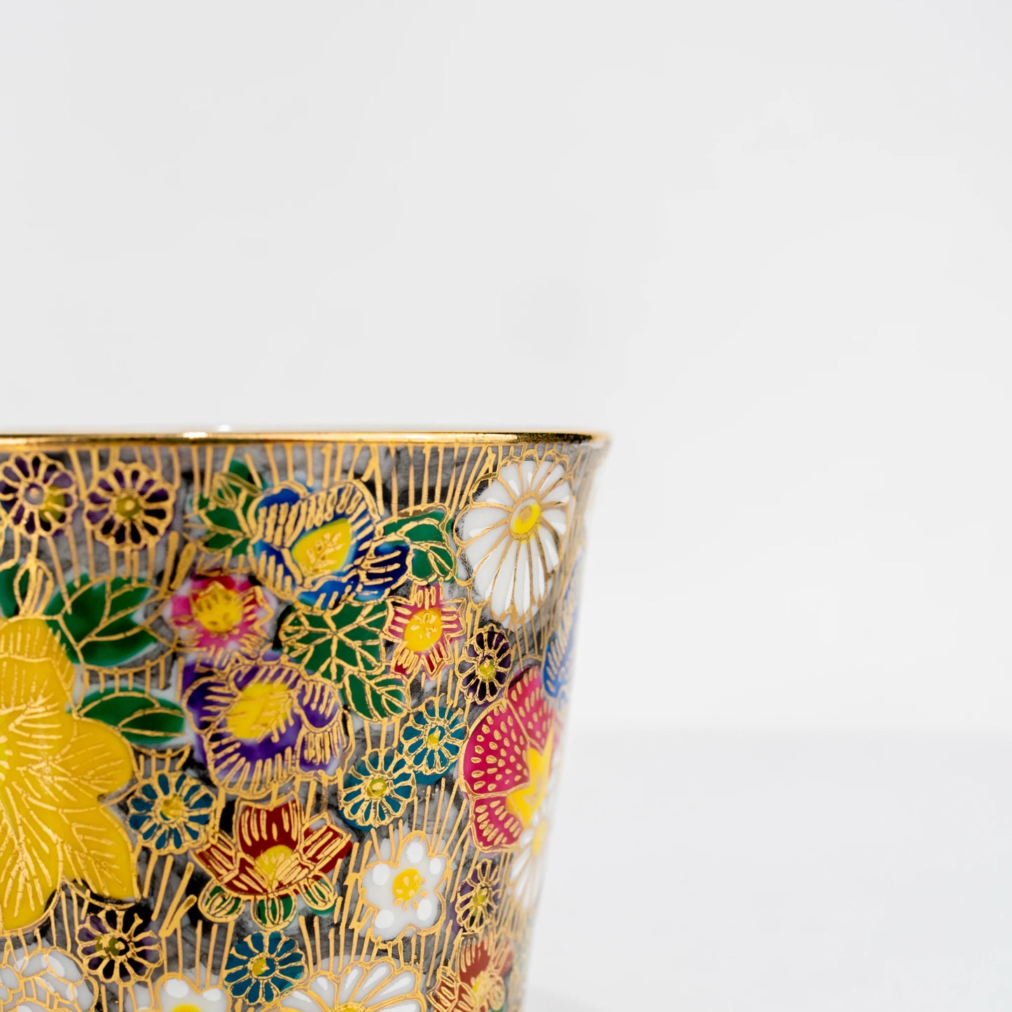 Close-up of Kutani gold floral cup showing painted pattern detail
