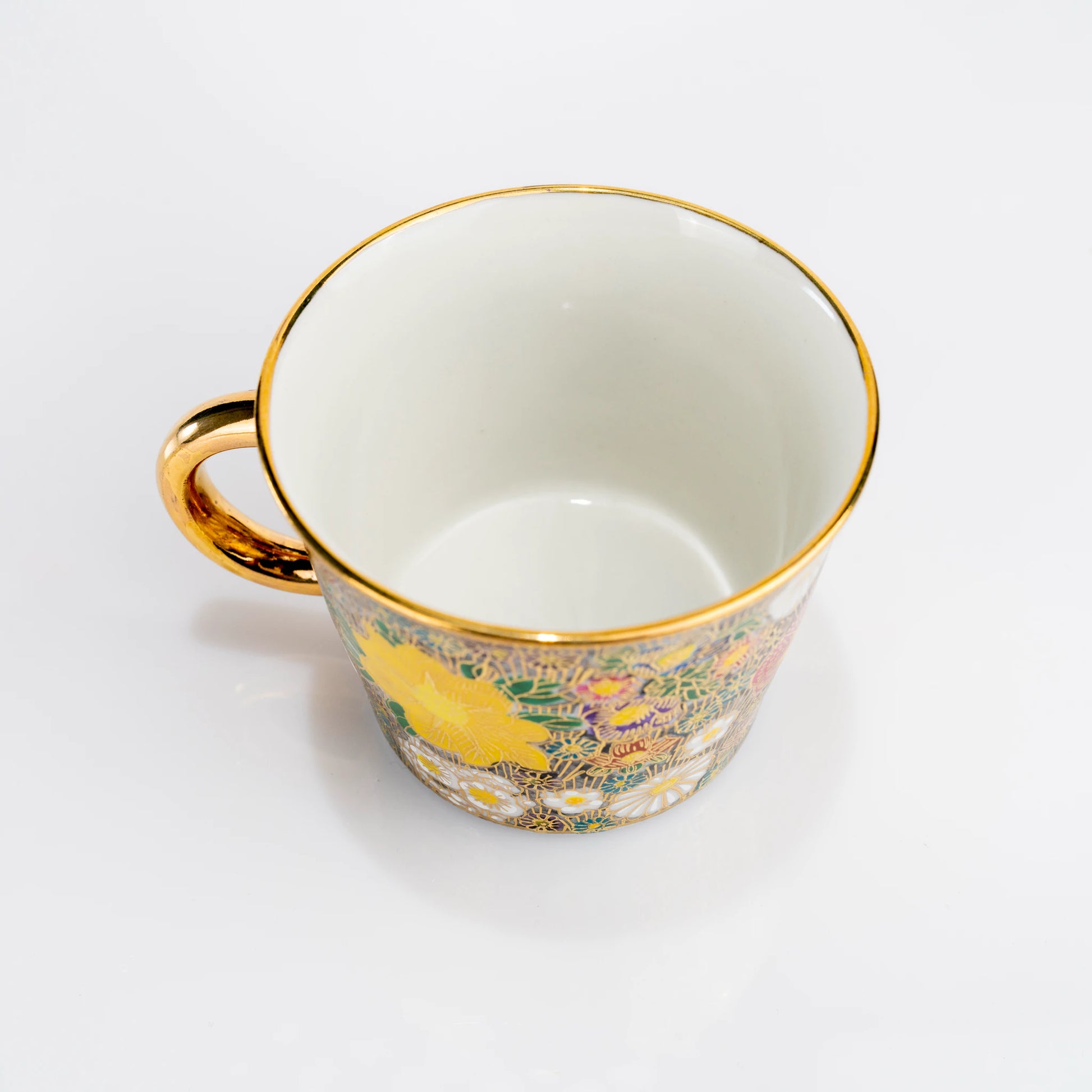 Top view inside Kutani porcelain cup with gold handle