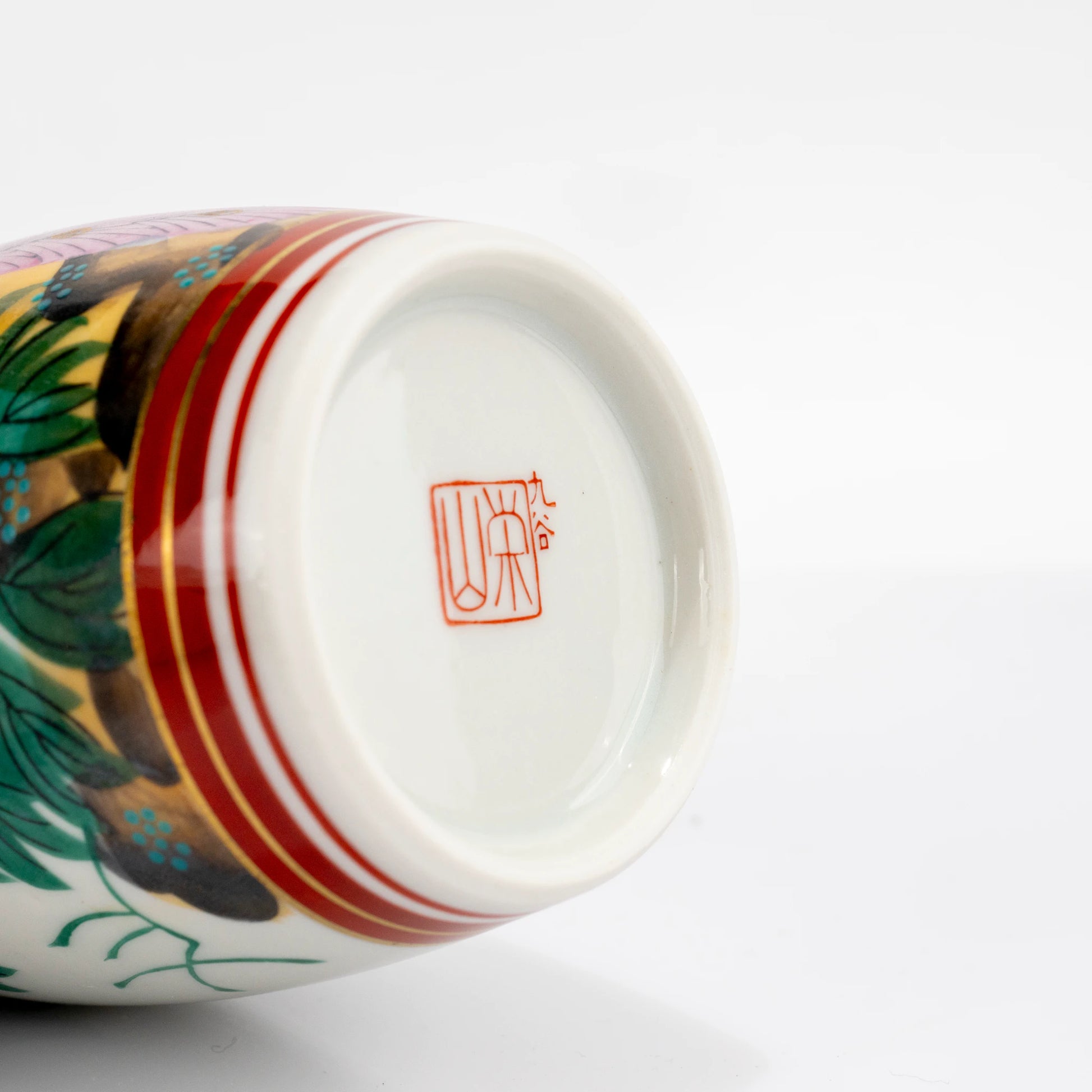 Bottom view of Kutani sake bottle base showing maker mark