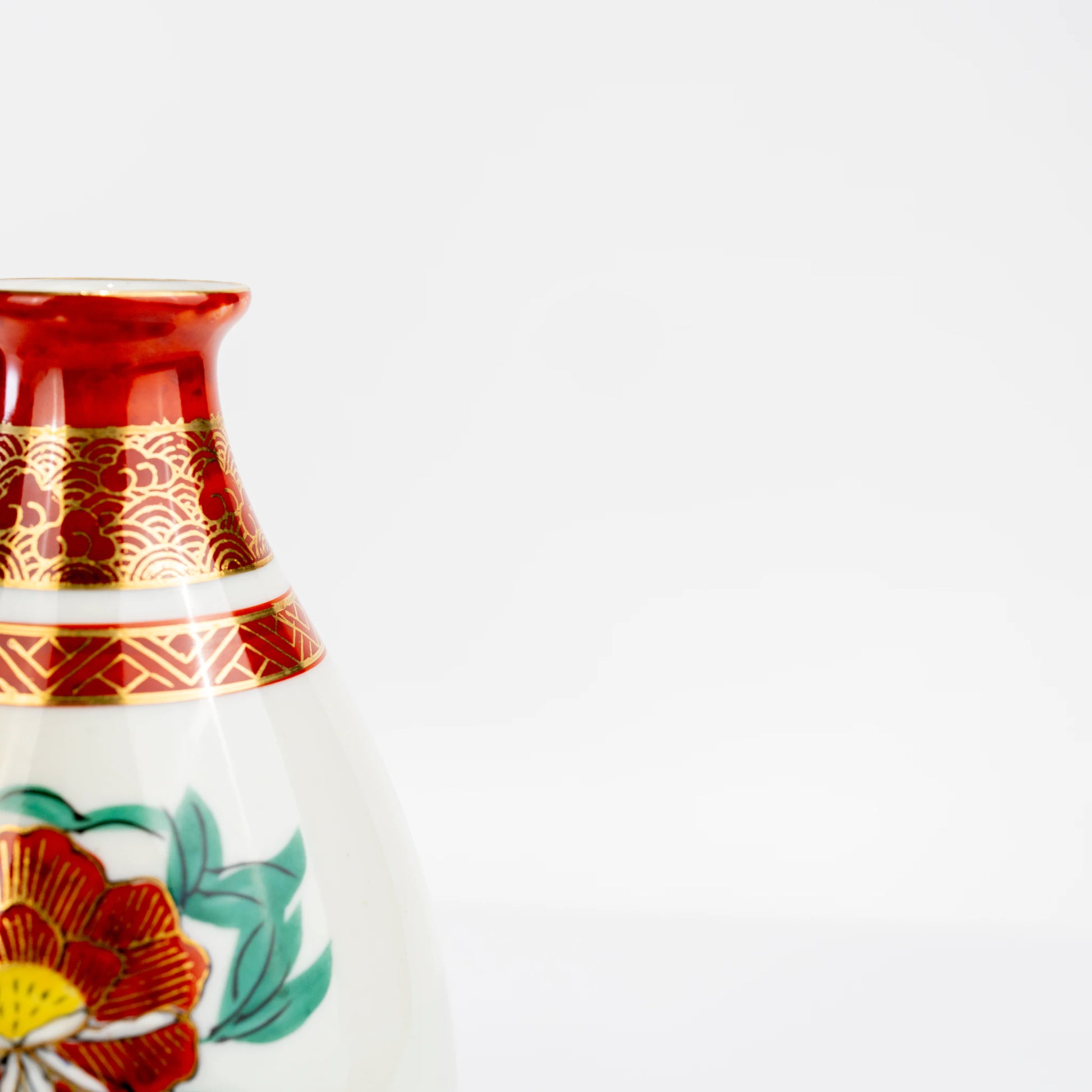 Close-up side view of Kutani peacock and peony tokkuri decoration