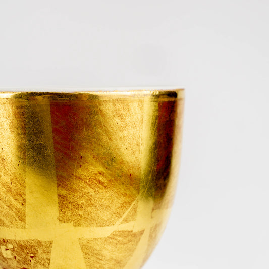 Close-up side view of Kutani red wine cup with gold leaf style finish