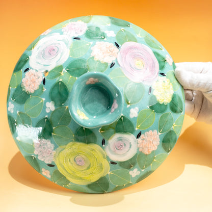 Top view of the floral porcelain lid for a Japanese donabe clay pot