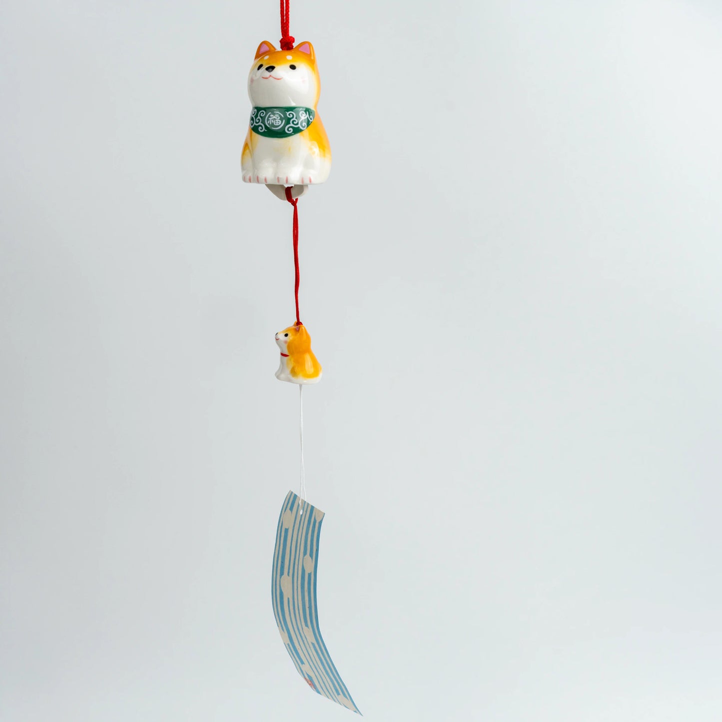 Full hanging view of Shiba Inu wind chime with paper strip