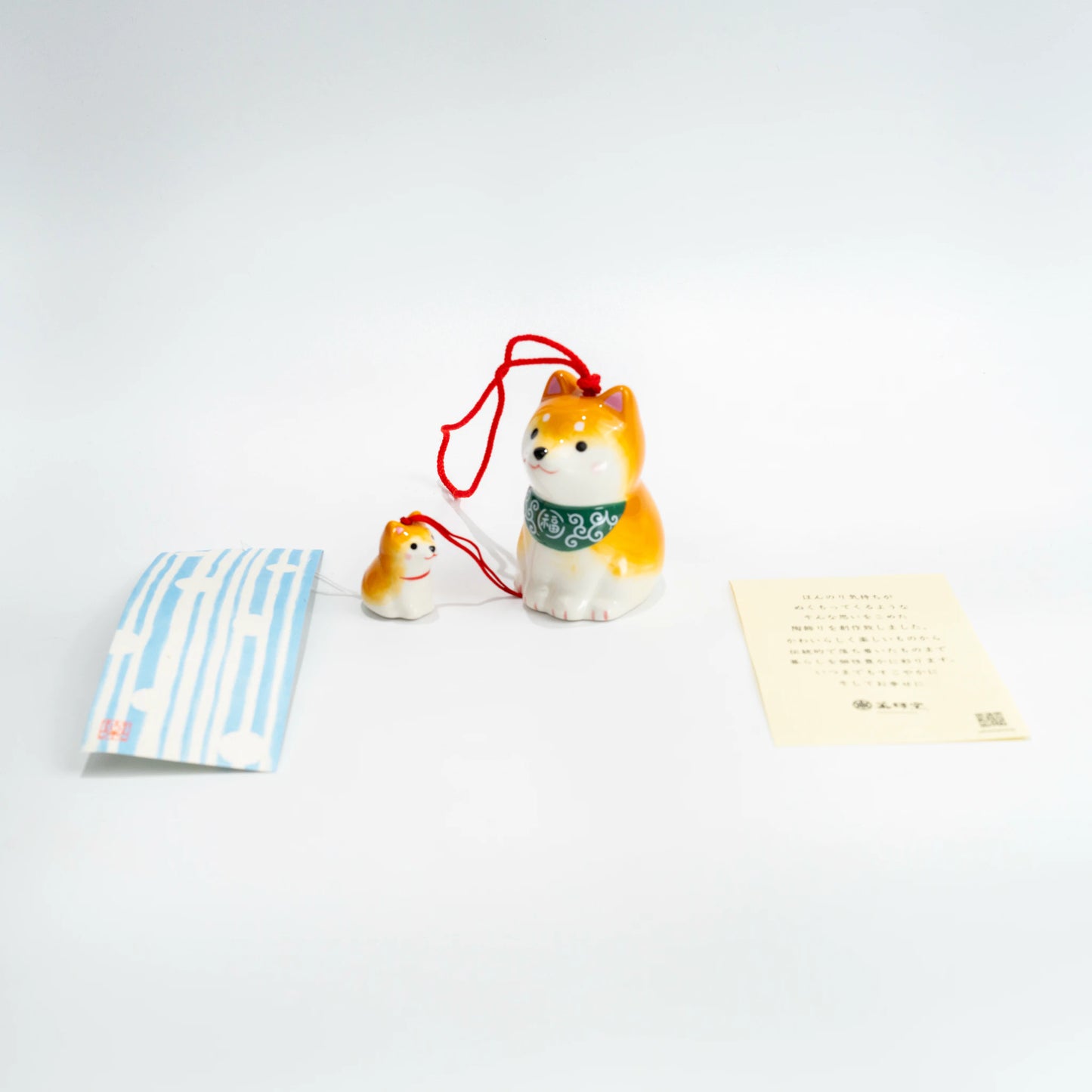Shiba wind chime set with paper strip and included tag laid out flat