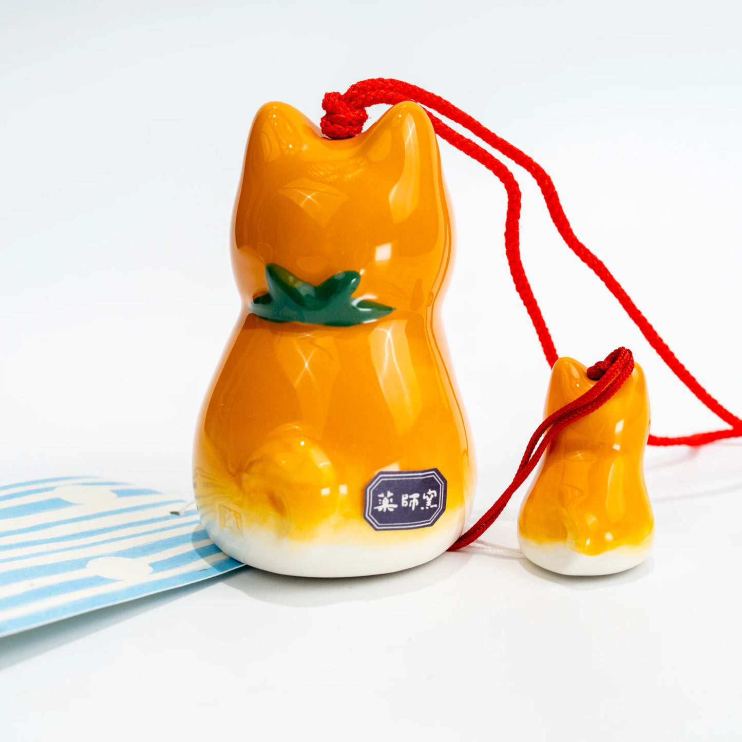Shiba wind chime set with paper strip and included tag laid out flat