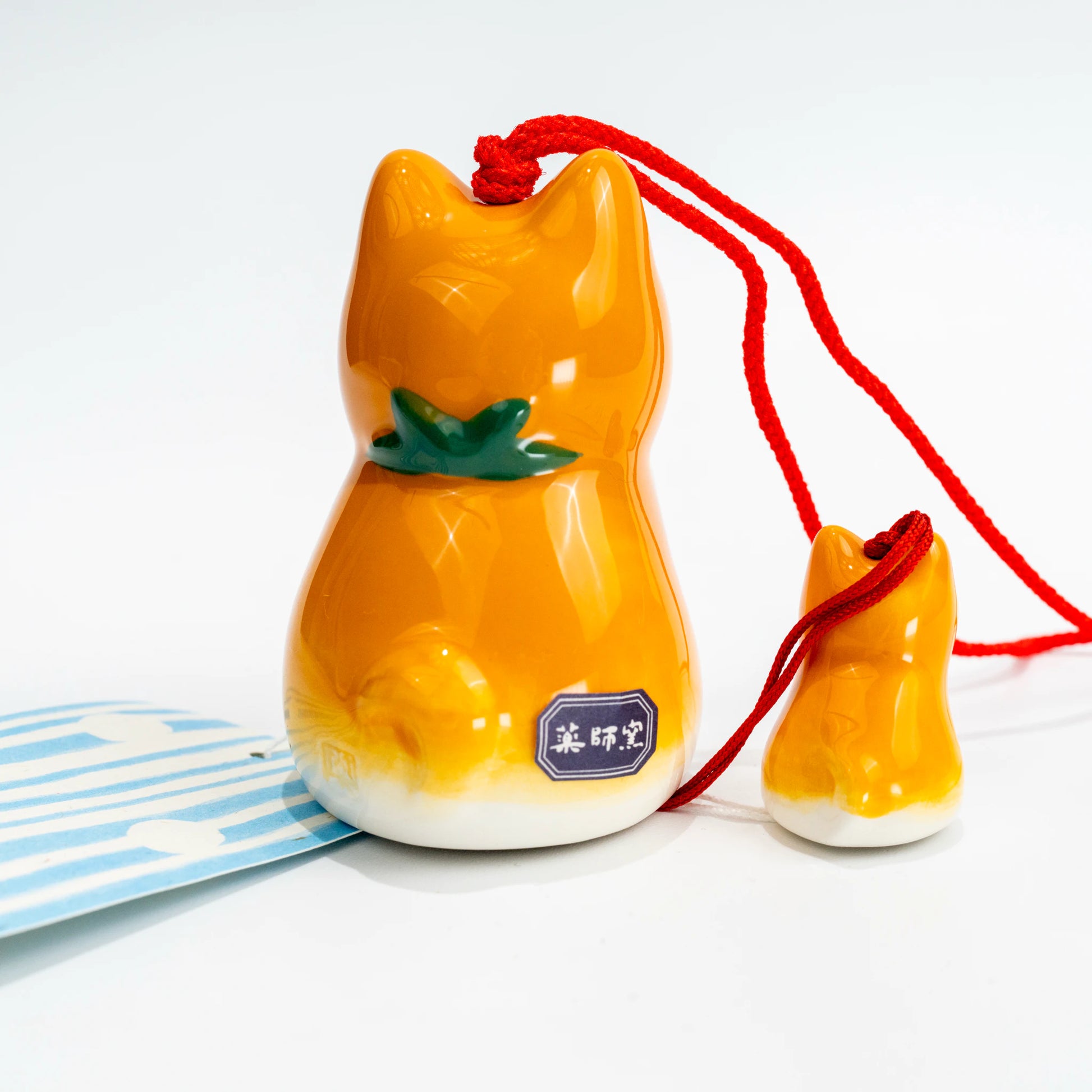 Shiba wind chime set with paper strip and included tag laid out flat