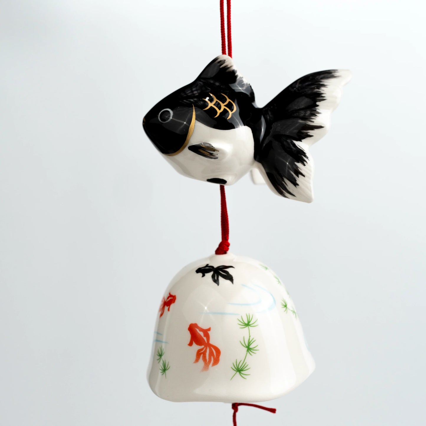 Black goldfish ceramic wind chime front hanging view