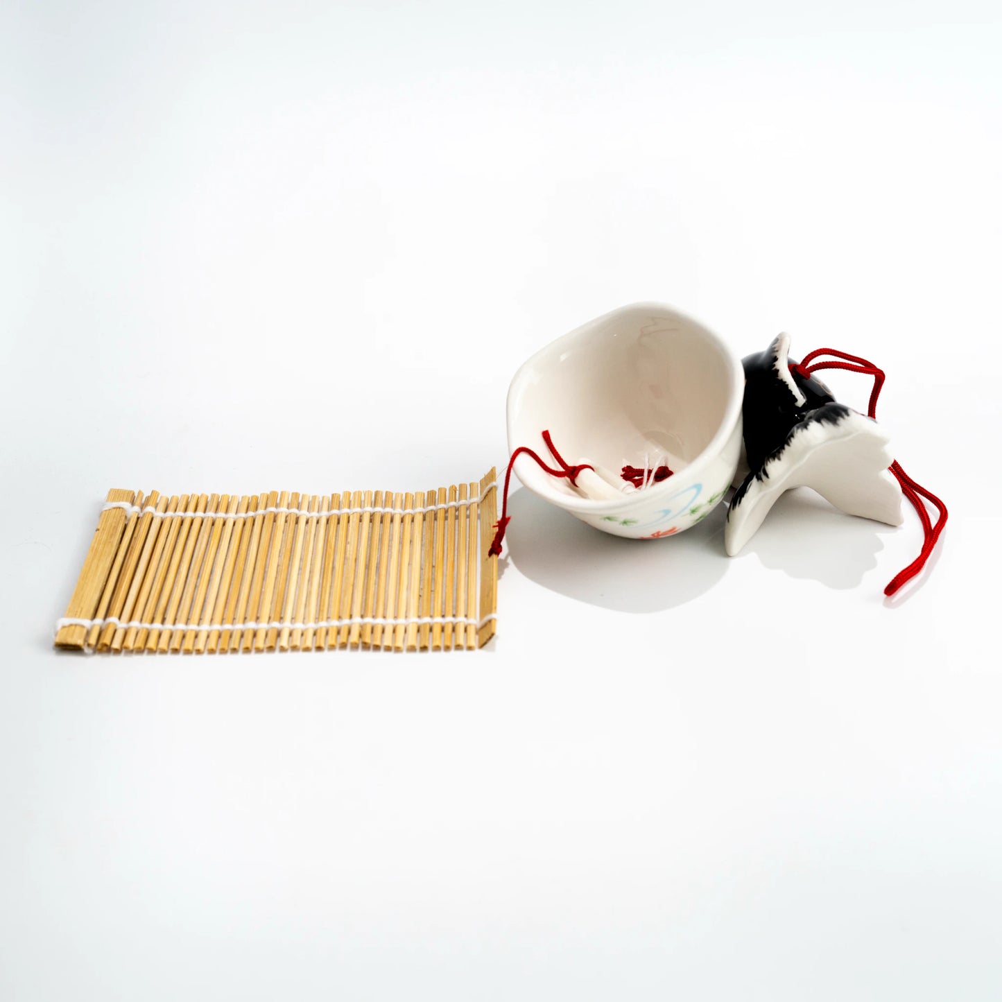 Side and underside view of black goldfish wind chime