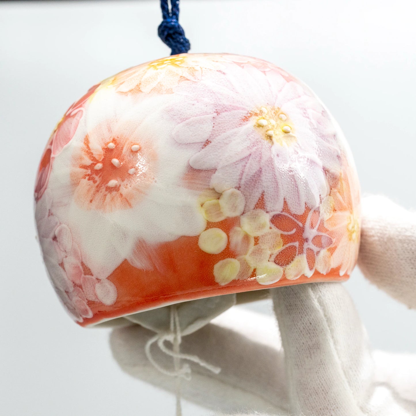 Close-up of hand-painted floral pattern on Japanese ceramic wind chime