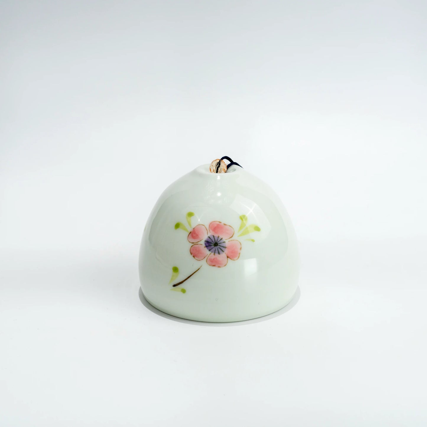 Side view of Arita ceramic wind chime with hanging strip