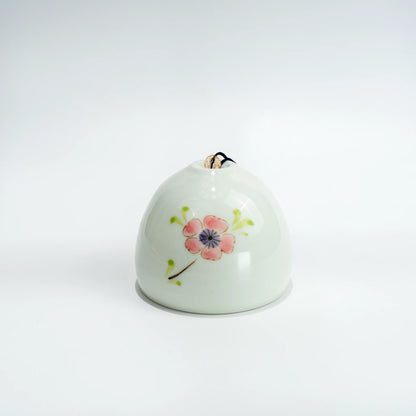 Side view of Arita ceramic wind chime with hanging strip