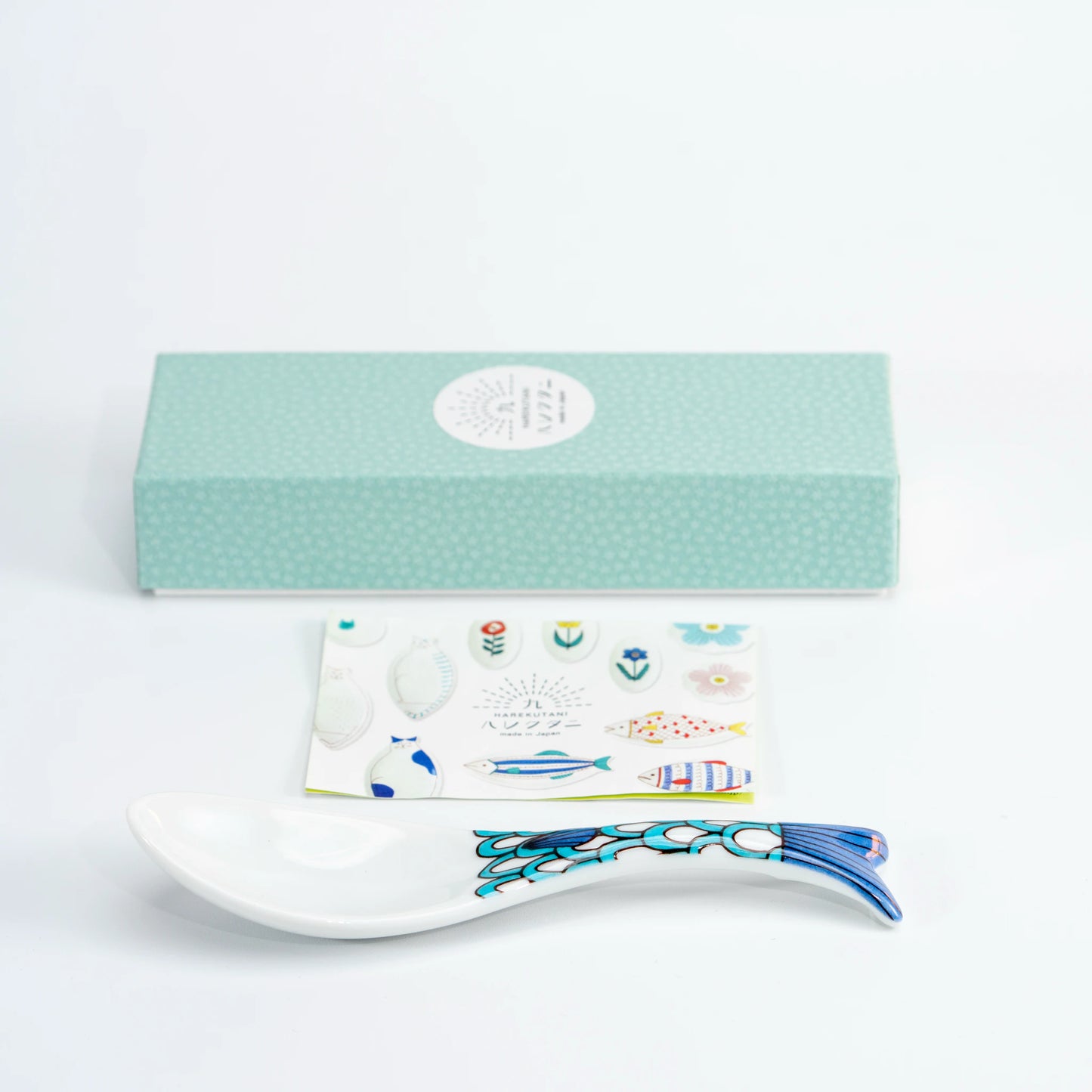 Kutani whale renge spoons displayed in a light blue individual gift box