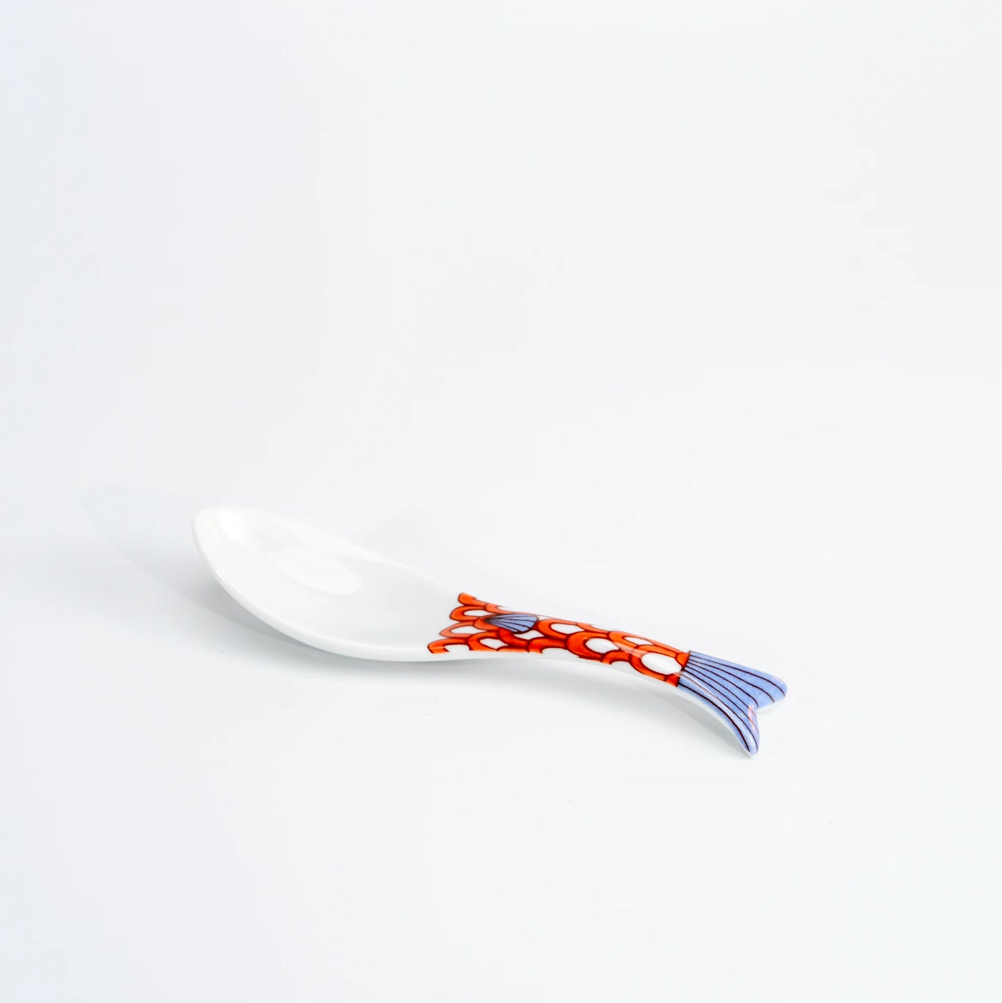 Single Kutani whale renge spoon with a purple and orange patterned whale-tail handle