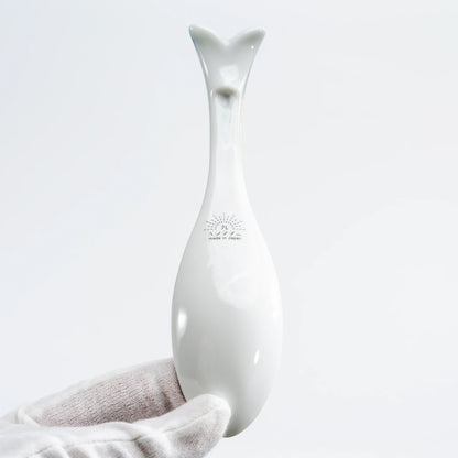Back view of a Kutani whale renge spoon showing the white porcelain underside and maker’s mark