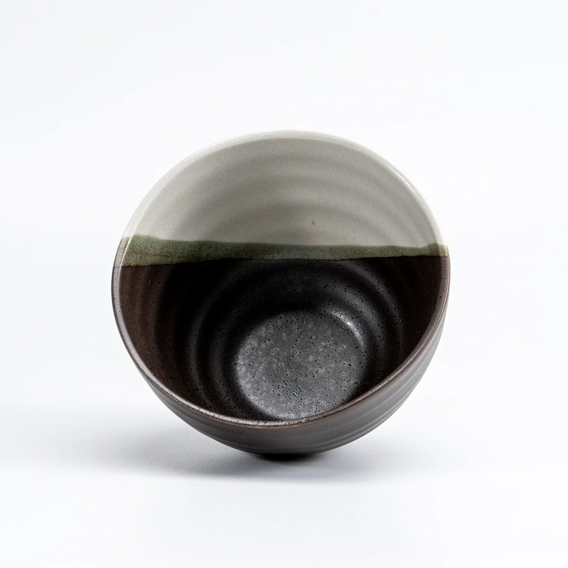 Angled close-up of hand-painted rabbit motif on Kutani Hidamari ceramic bowl