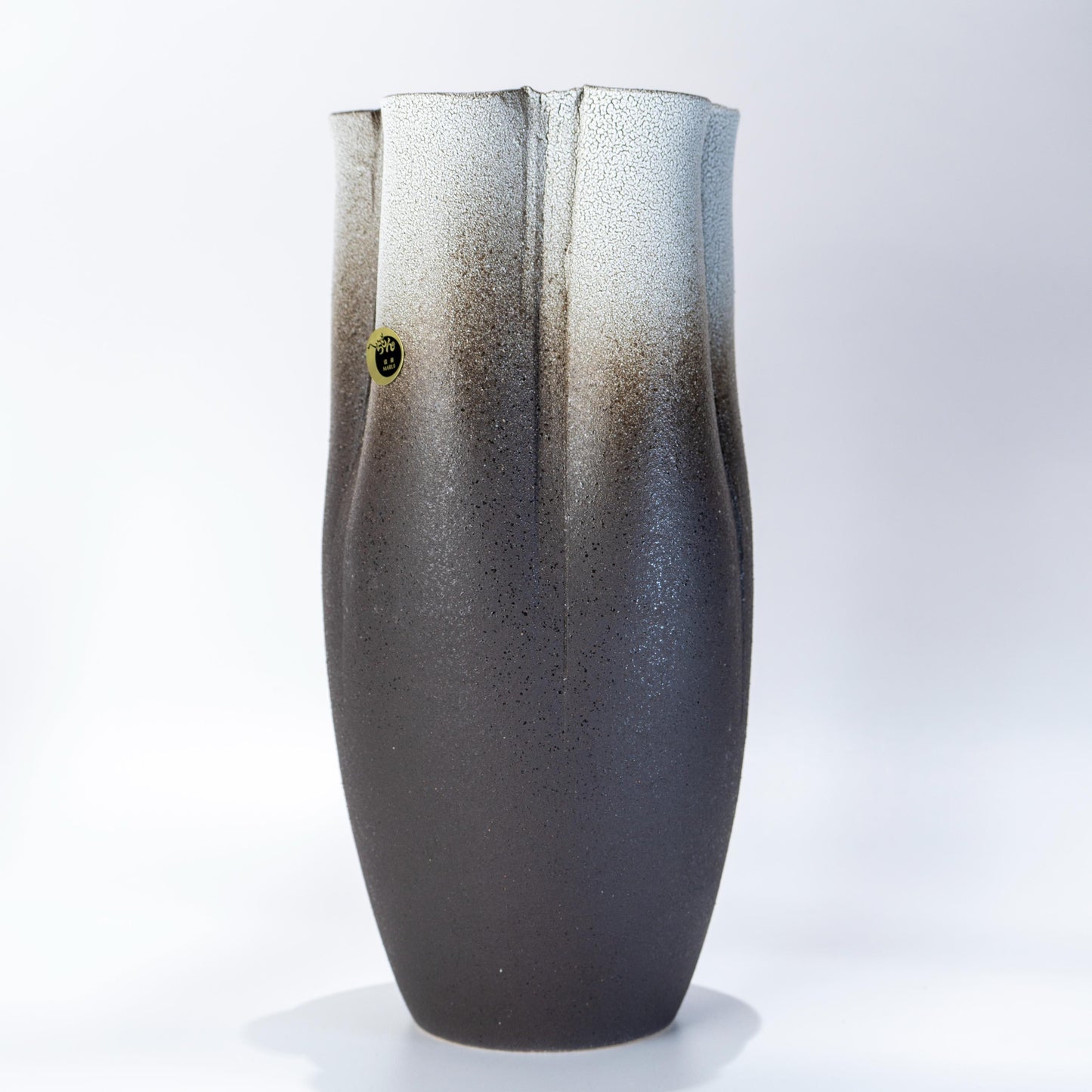 Full view of a handmade Japanese Shigaraki tall ikebana vase
