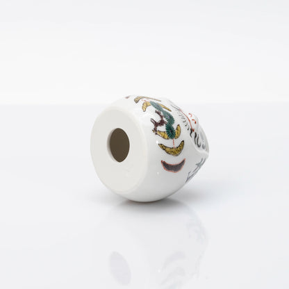 Underside and side detail of Kutani Daruma figurine