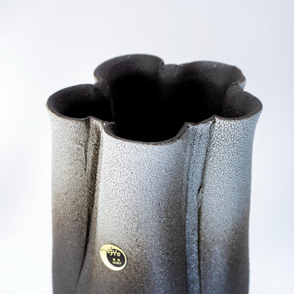 Texture detail of handmade Shigaraki tall vase in black and white glaze