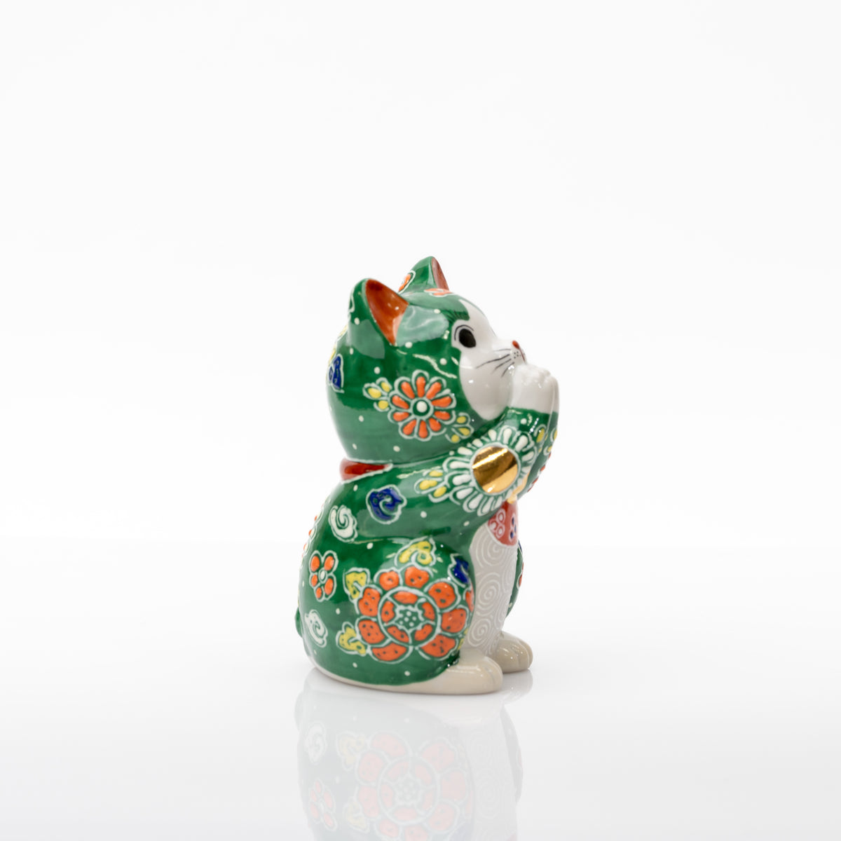 Opposite side of the green praying cat showing an orange flower, joined paws, and a gold-colored paw circle.
