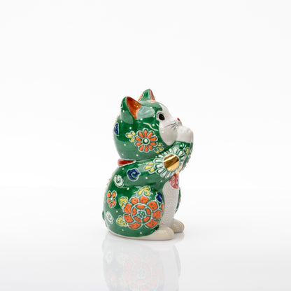 Opposite side of the green praying cat showing an orange flower, joined paws, and a gold-colored paw circle.