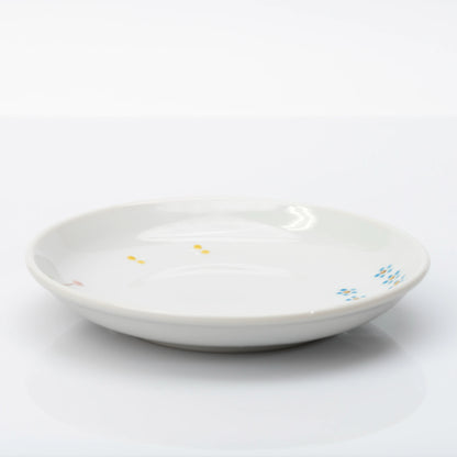 Side profile of white Kutani plate with small floral details