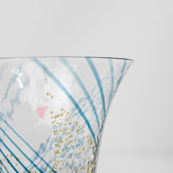 Close-up of gold pattern on blue sake cup