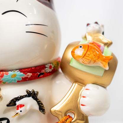 Front view of ceramic lucky cat figurine with raised paw