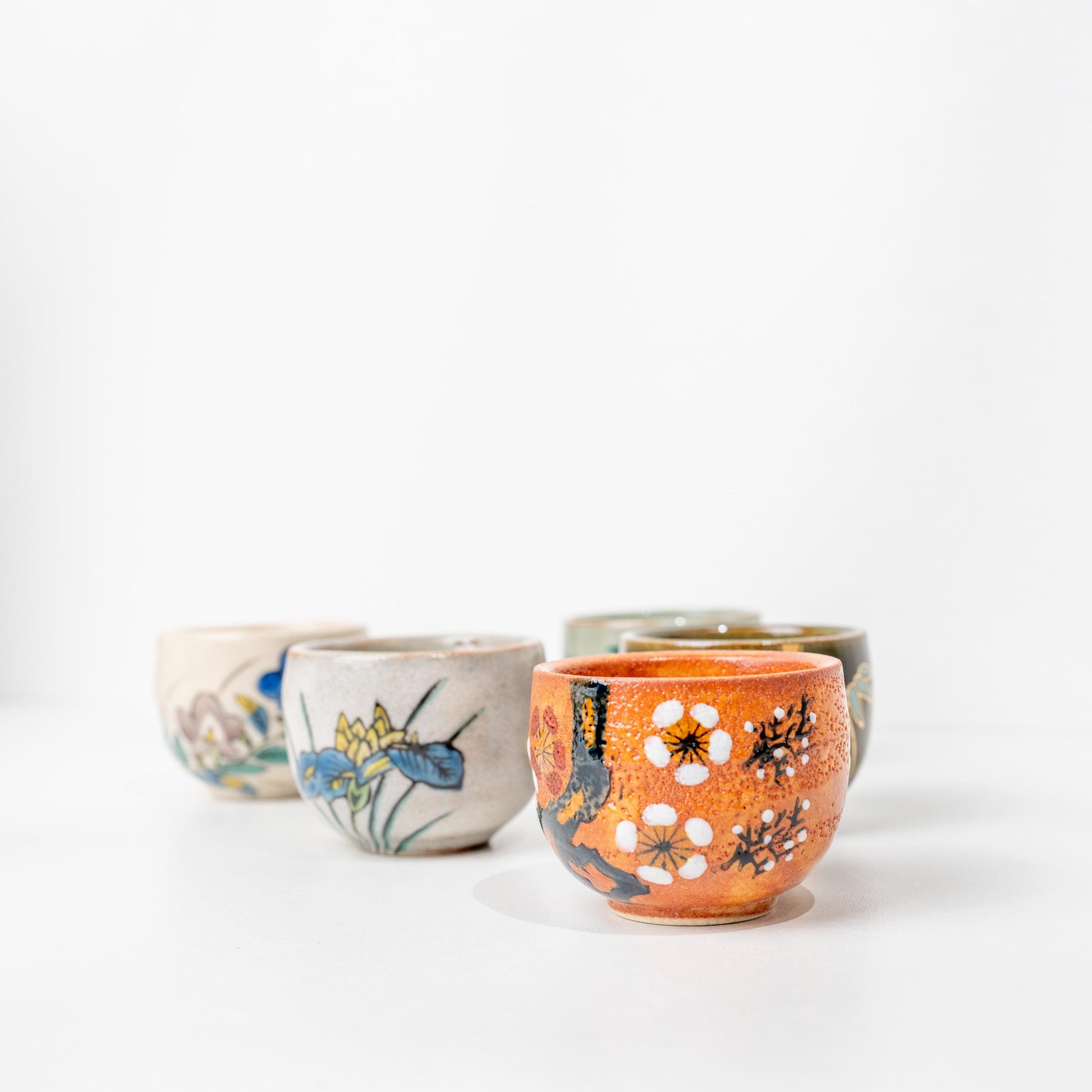 Kutani sake cups displayed side by side