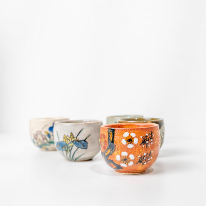 Kutani sake cups displayed side by side