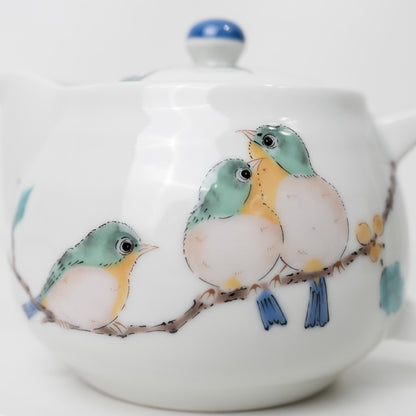 Side view of Japanese porcelain kyusu with painted bird motif