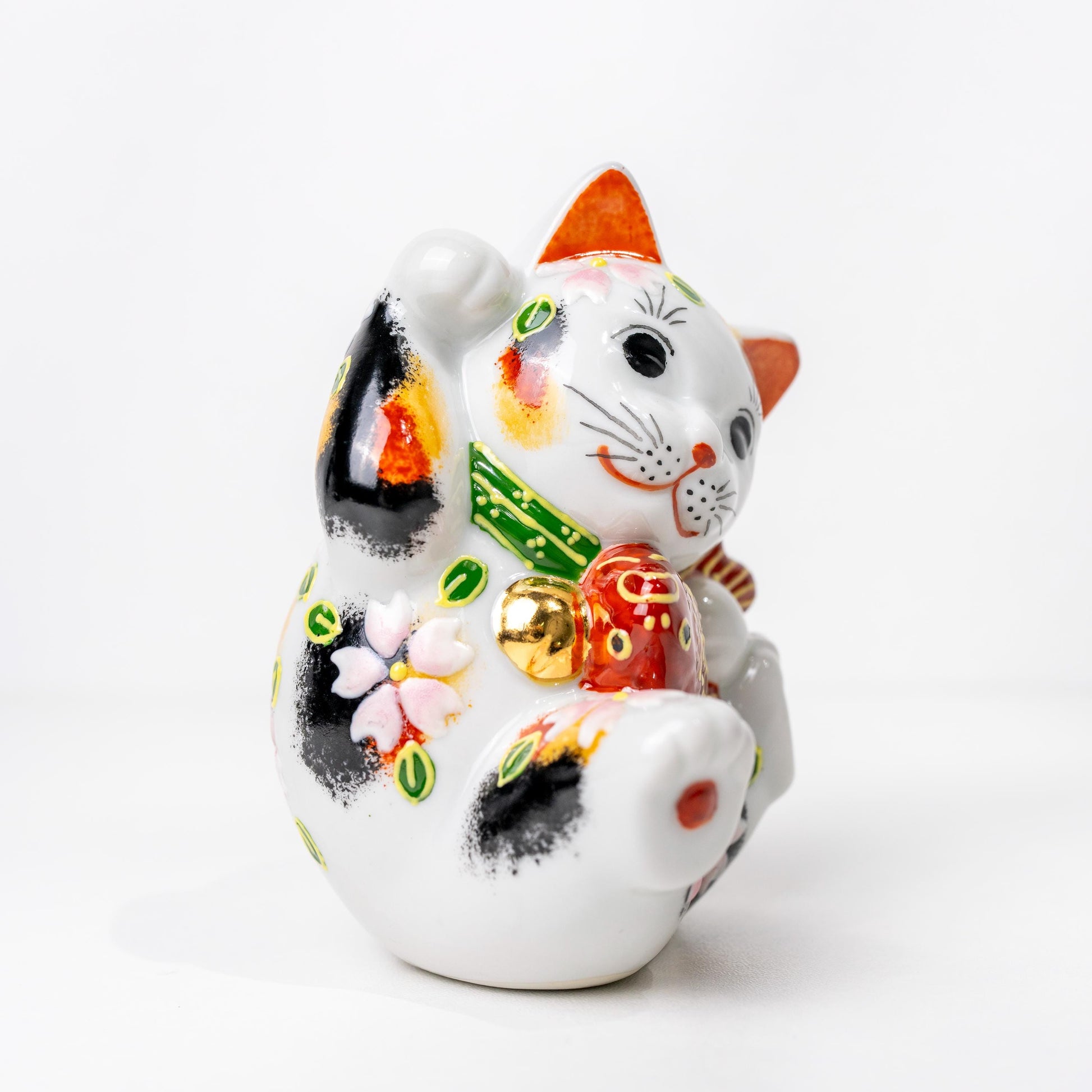 Underside of ceramic lucky cat showing base opening