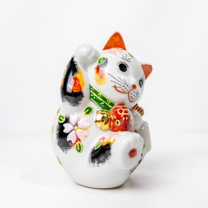 Underside of ceramic lucky cat showing base opening