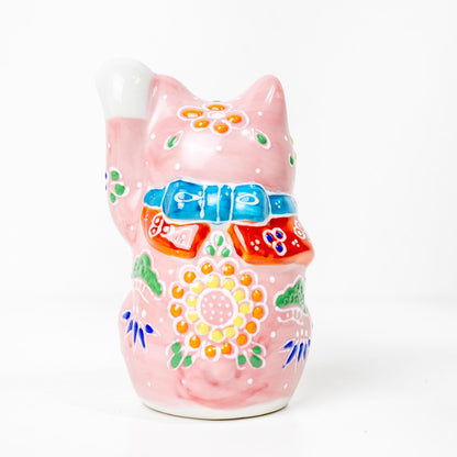 Side view of pink Kutani Maneki Neko with floral decoration