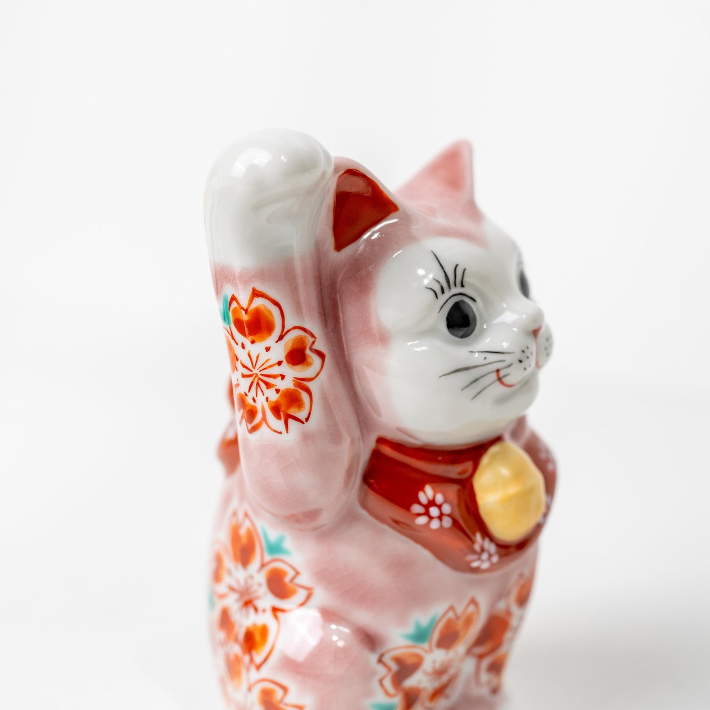 Three-quarter view of Japanese lucky cat statue