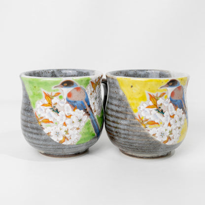 Two Japanese porcelain mugs shown side by side