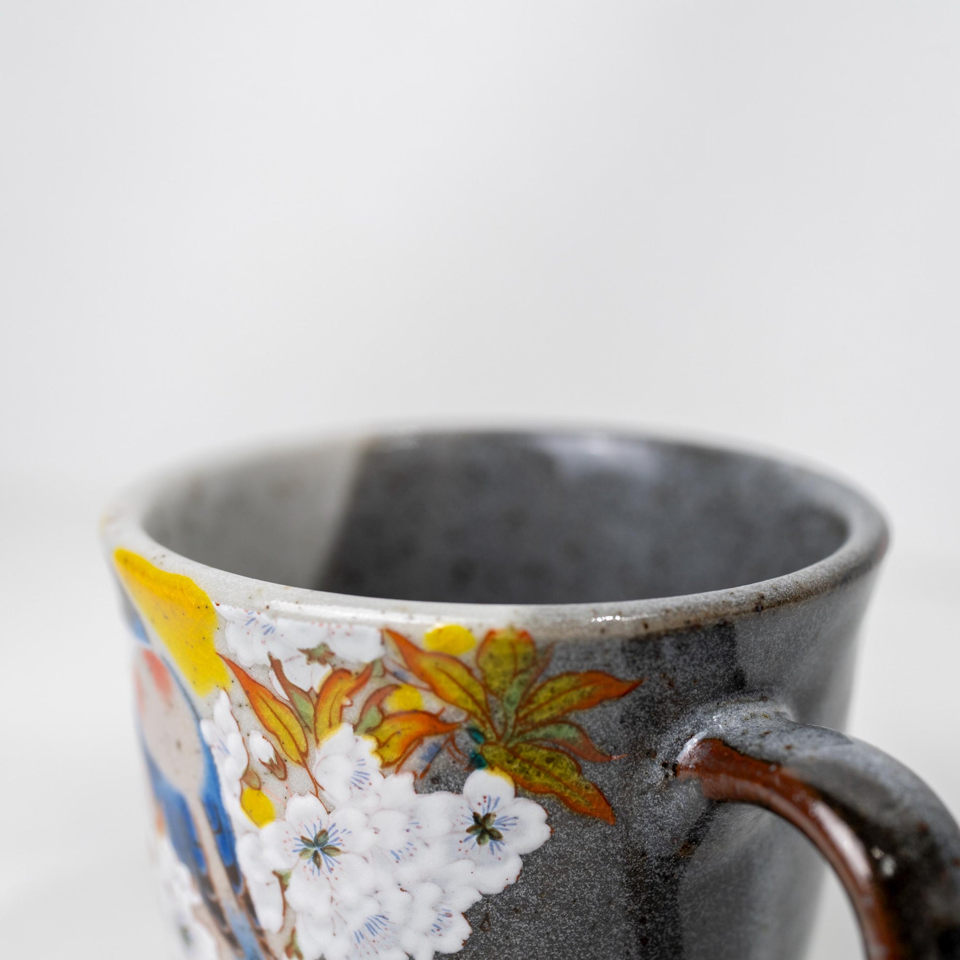 Front angle of Kutani ceramic mug with bird motif