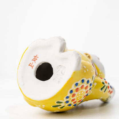 Underside of Kutani ceramic figurine showing base opening