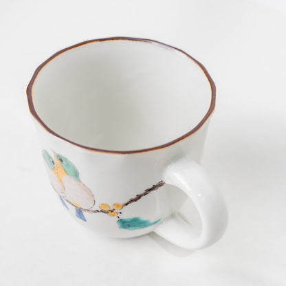 Three-quarter view of Kutani bird mug with handle