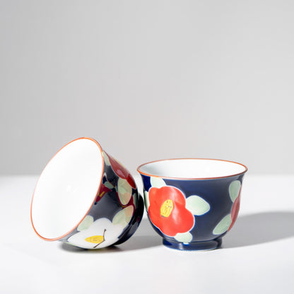 Side view of Arita porcelain teapot with hand-painted camellia design