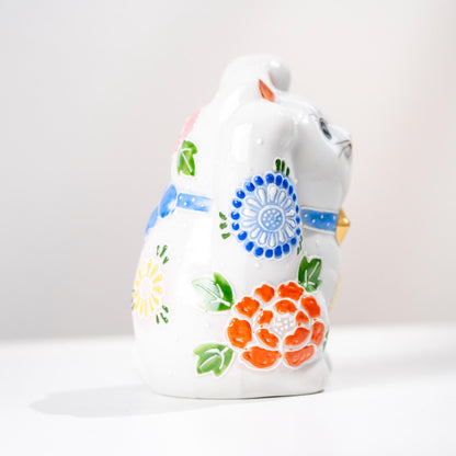 Lower front angle of double paw Maneki Neko statue