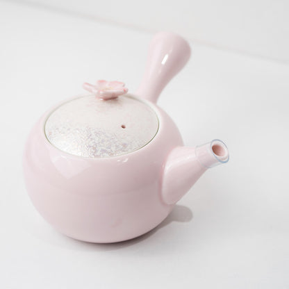 Angled view of pink porcelain kyusu teapot