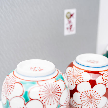 Side view of Kutani porcelain teapot with plum blossom motif