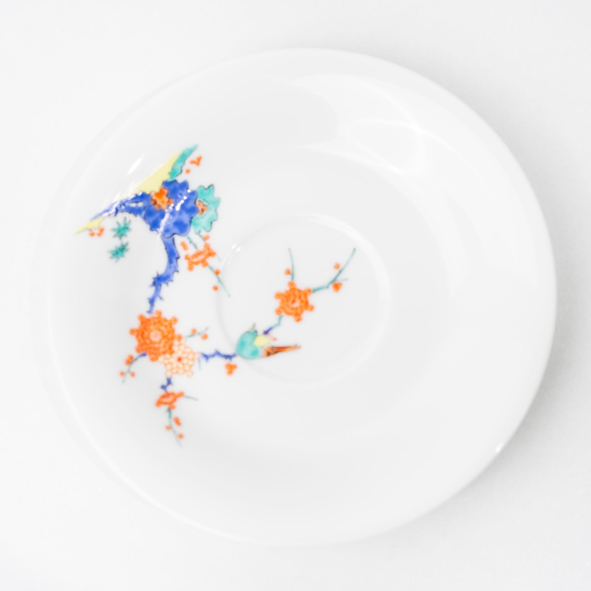 Top view of Arita porcelain saucer showing painted detail