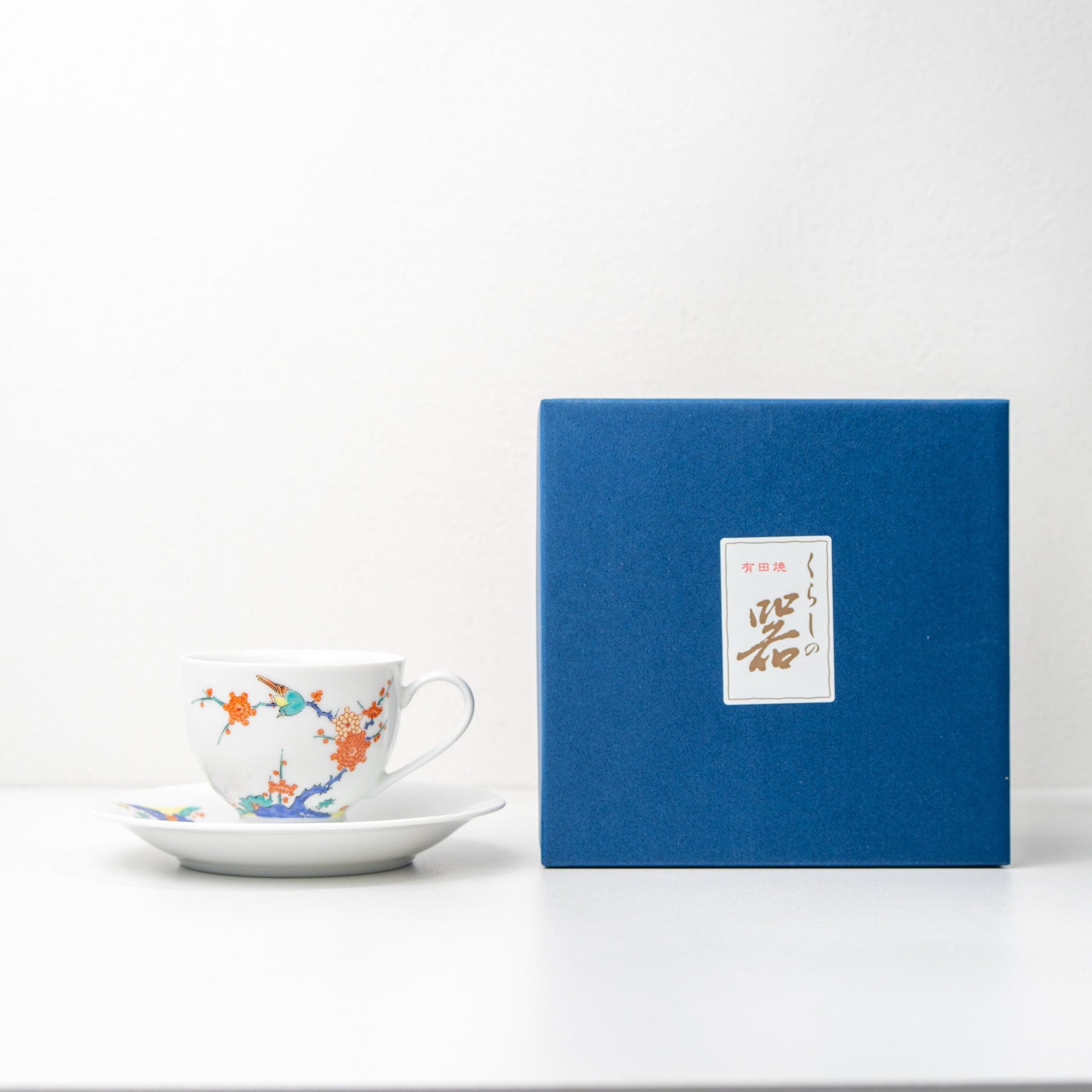 Blue gift box with Arita bird and plum blossom cup and saucer set