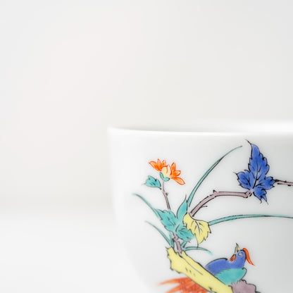 Side view of hand-painted porcelain coffee cup and saucer in Arita ware