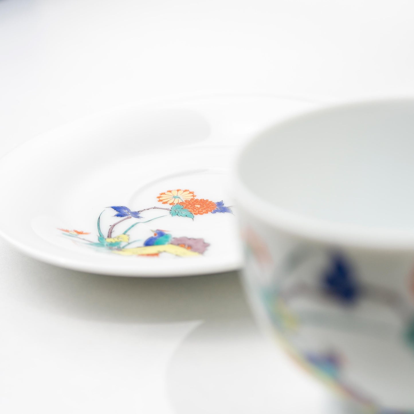 Detail of the footed base and painted motif on an Arita coffee cup