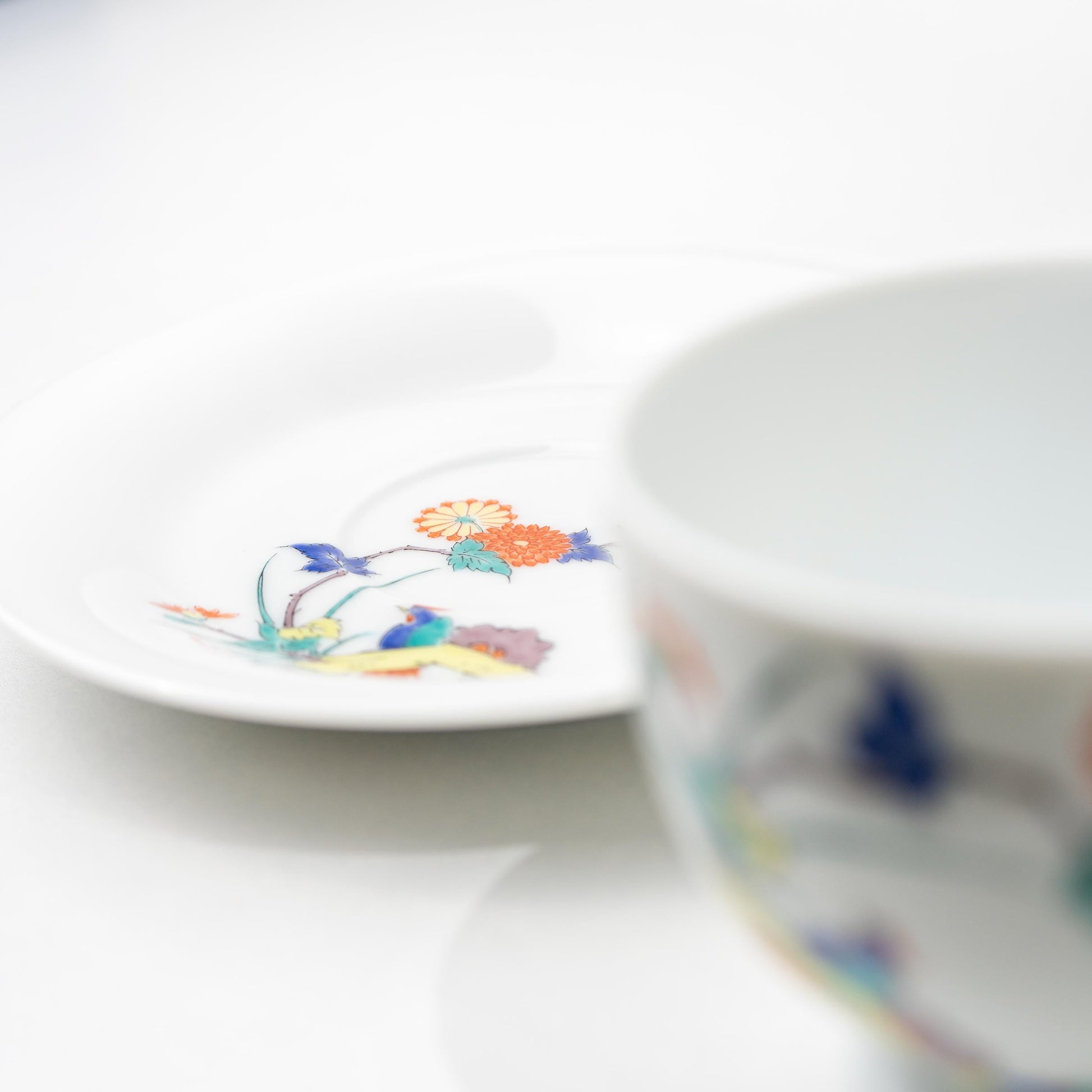 Detail of the footed base and painted motif on an Arita coffee cup