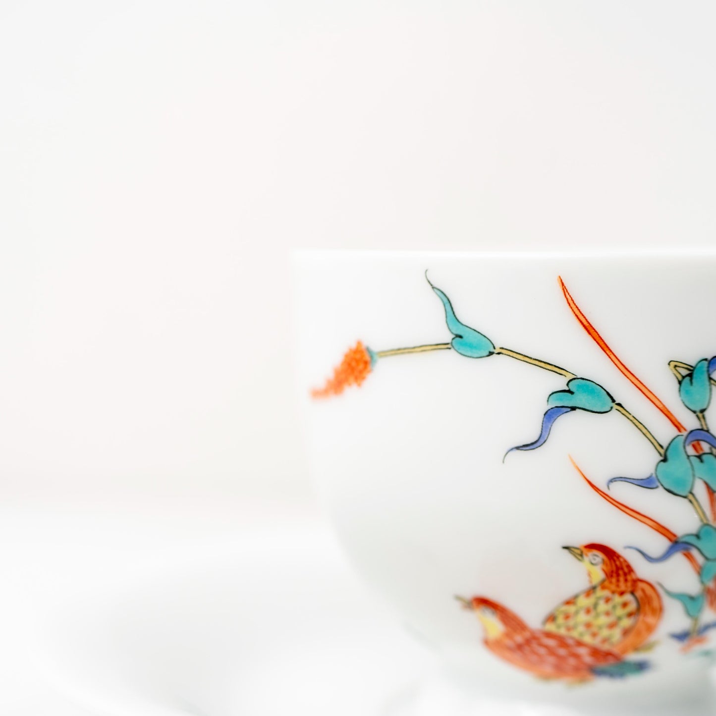 Close-up of quail and autumn grass motif on an Arita porcelain cup