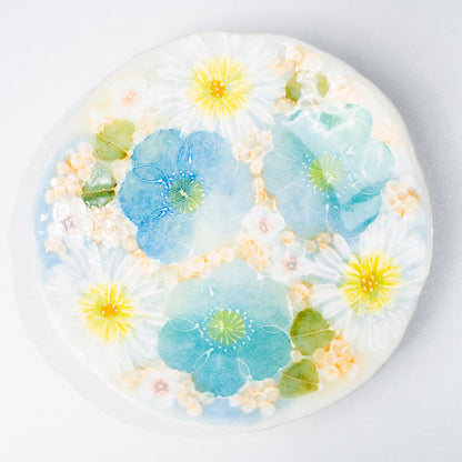 Close-up of blue floral motif on saucer