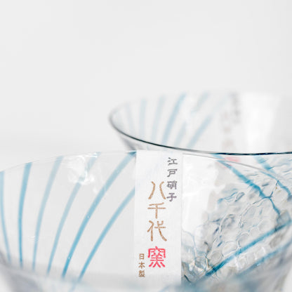 Detail view of blue-and-gold handcrafted sake cup